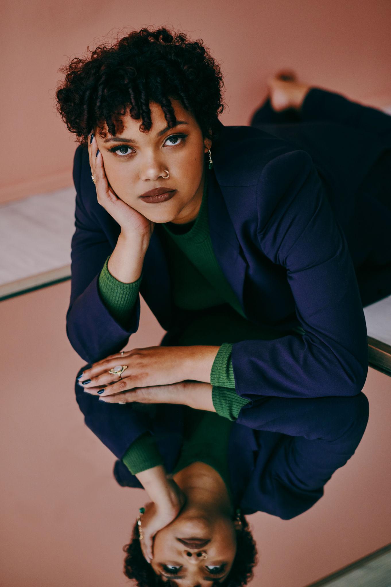 woman with hand on chin thinking