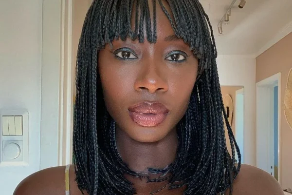 black woman on flip braids