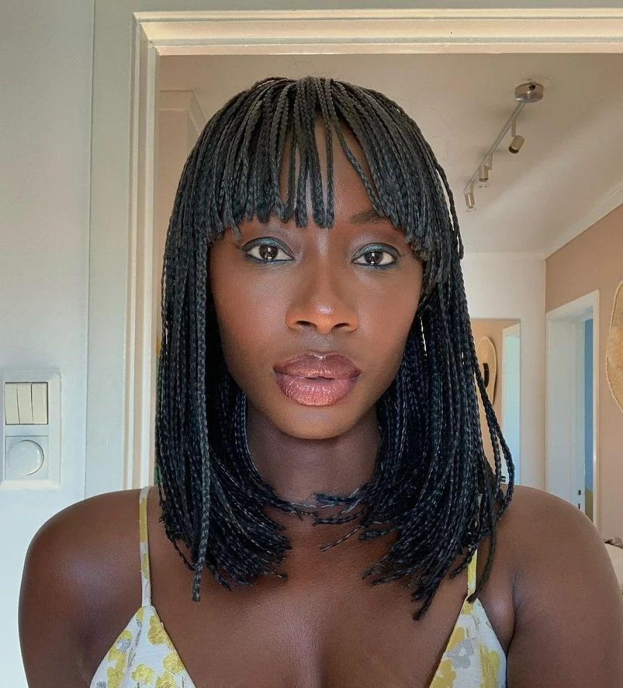 black woman on flip braids