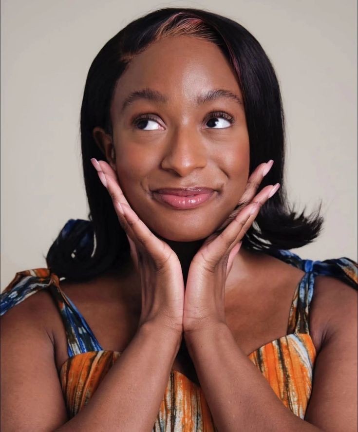 dj cuppy with hands on chin